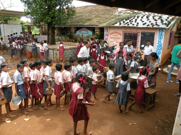 Children lining up for their midday meal